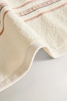 TOWEL WITH CREASED EFFECT BORDER