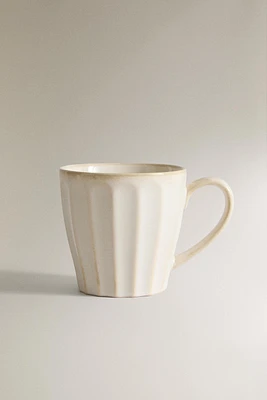 STONEWARE MUG WITH RAISED DESIGN