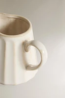 STONEWARE CREAM PITCHER WITH RAISED DESIGN