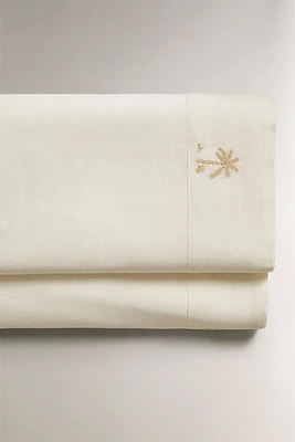 FLAT SHEET WITH EMBROIDERED PALM TREES