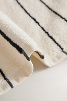 TOWEL WITH IRREGULAR STRIPES