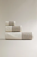 COTTON BATH TOWEL WITH A STRIPED BORDER