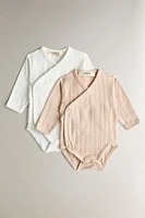 CHILDREN’S SET OF BODYSUITS