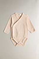 CHILDREN’S SET OF BODYSUITS