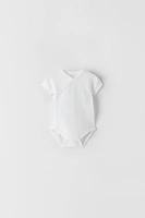 THREE-PACK OF SHORT SLEEVE SURPLICE BODYSUITS