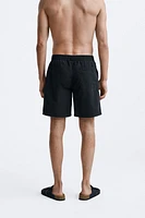 LONGLINE SWIMMING TRUNKS