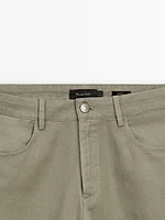 Tapered-fit denim trousers