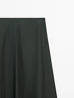 Flowing midi skirt with crackled finish