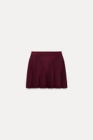 BOX PLEAT KNIT MINI SKIRT