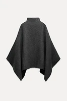 ASYMMETRIC KNIT CAPE