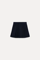 BOX PLEAT KNIT MINI SKIRT