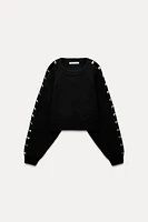 BOBBLE SLEEVE KNIT SWEATER