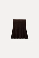 PLEATED SOLID KNIT SKIRT