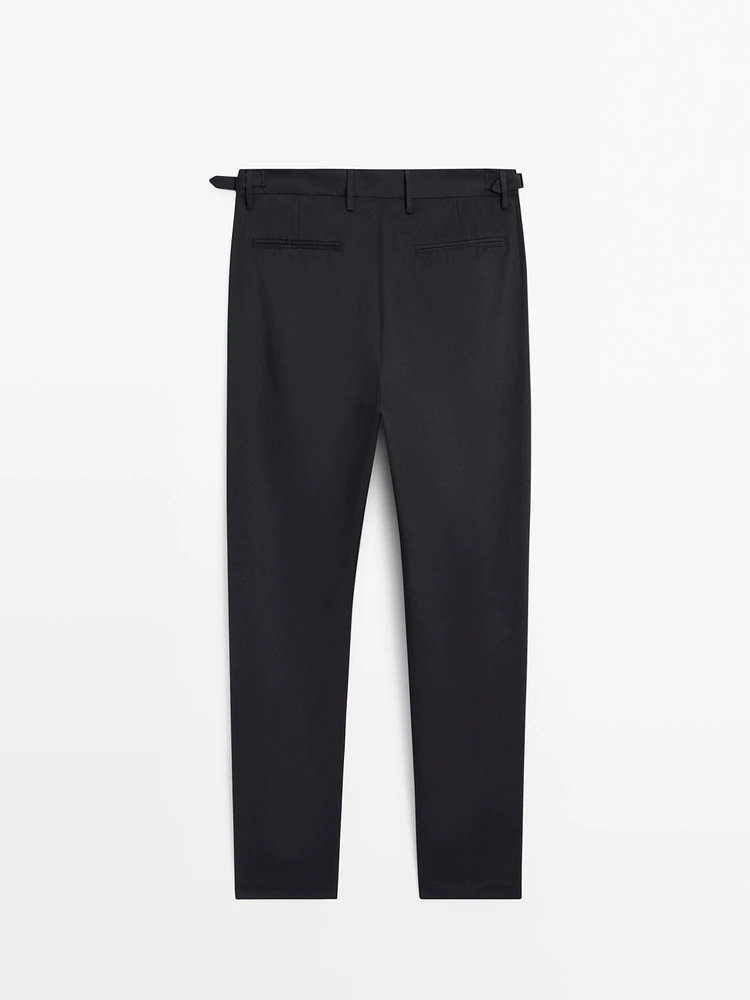 Tapered fit trousers with buckle detail