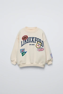 SWEATSHIRT WITH PATCHES