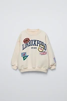 SWEATSHIRT WITH PATCHES