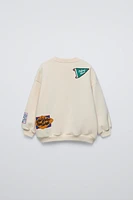 SWEATSHIRT WITH PATCHES