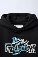 GRAFFITI PRINT HOODED SWEATSHIRT