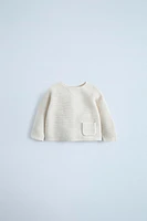 PULL EN MAILLE À POCHE