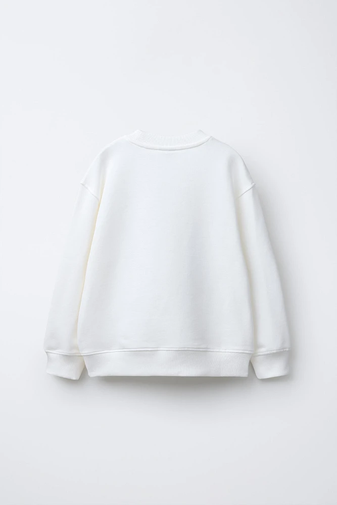 DOLL PRINT SWEATSHIRT