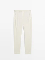 Tapered fit trousers with buckle detail