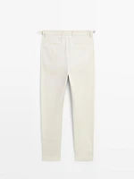 Tapered fit trousers with buckle detail