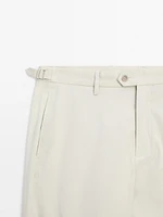 Tapered fit trousers with buckle detail