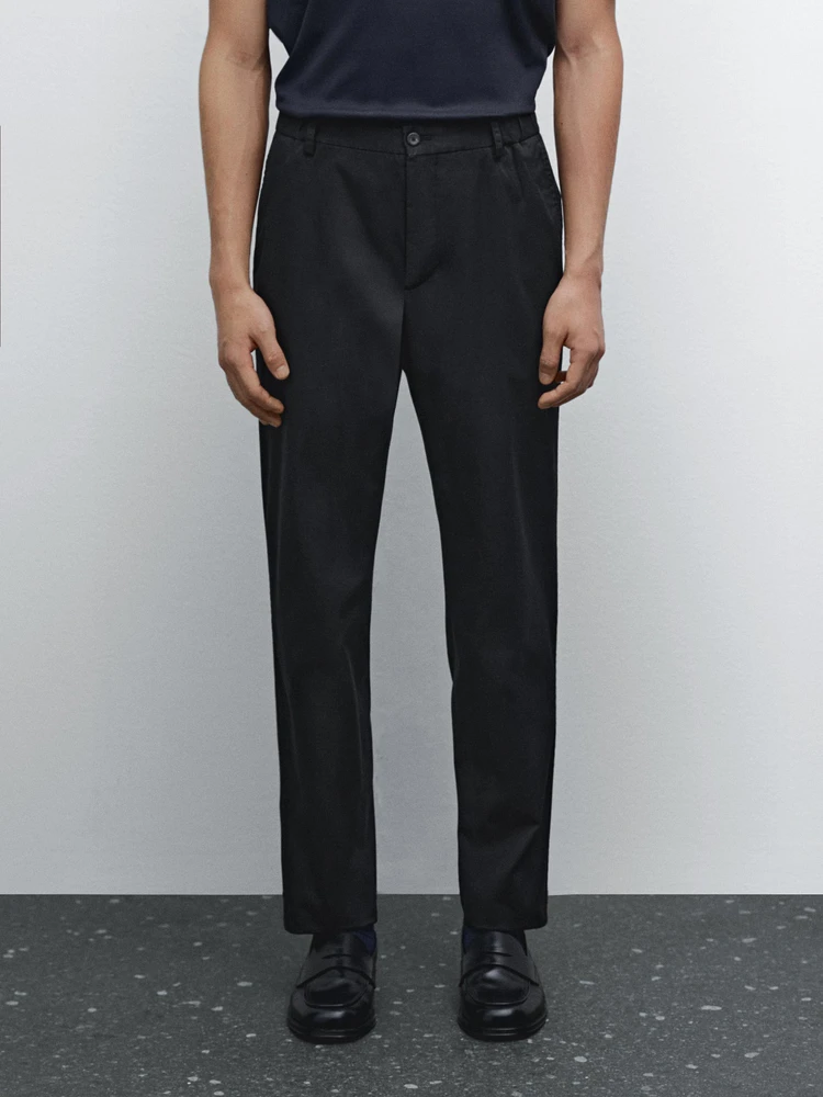 Tapered fit trousers with side elastic detail