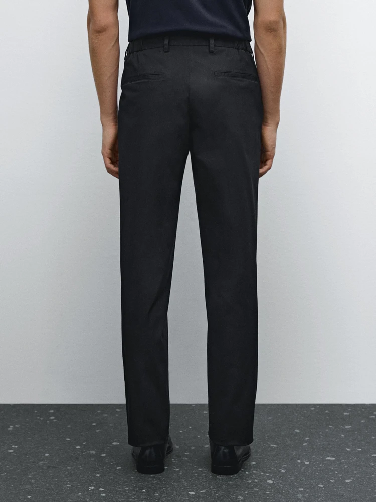 Tapered fit trousers with side elastic detail