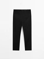 Tapered fit trousers with side elastic detail