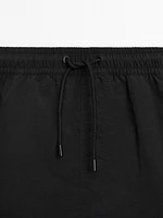 Plain swimming trunks with elastic waistband