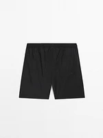 Plain swimming trunks with elastic waistband