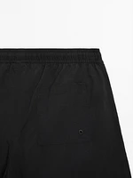 Plain swimming trunks with elastic waistband