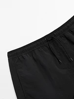 Plain swimming trunks with elastic waistband