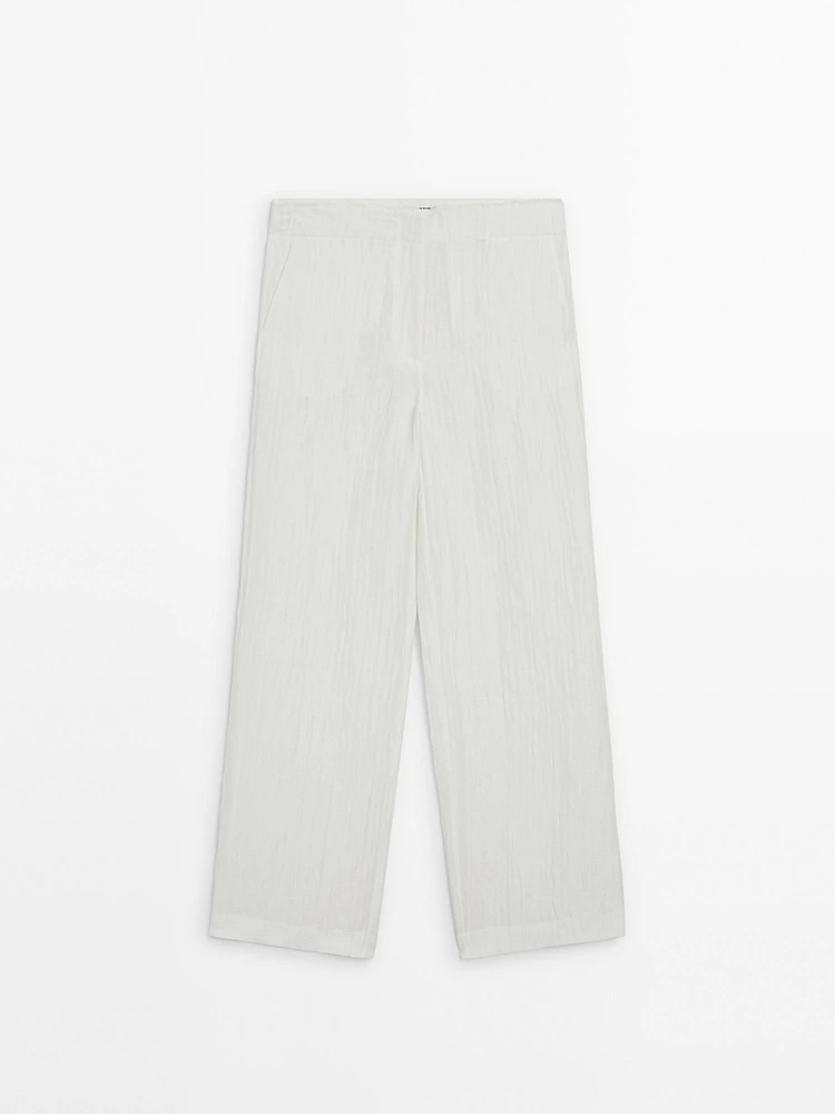 Flowing creased-effect trousers