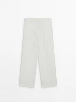 Flowing creased-effect trousers