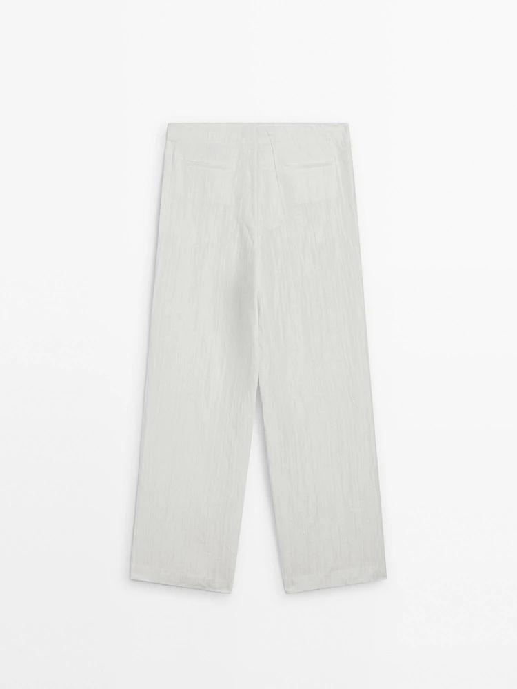 Flowing creased-effect trousers