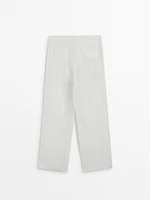 Flowing creased-effect trousers