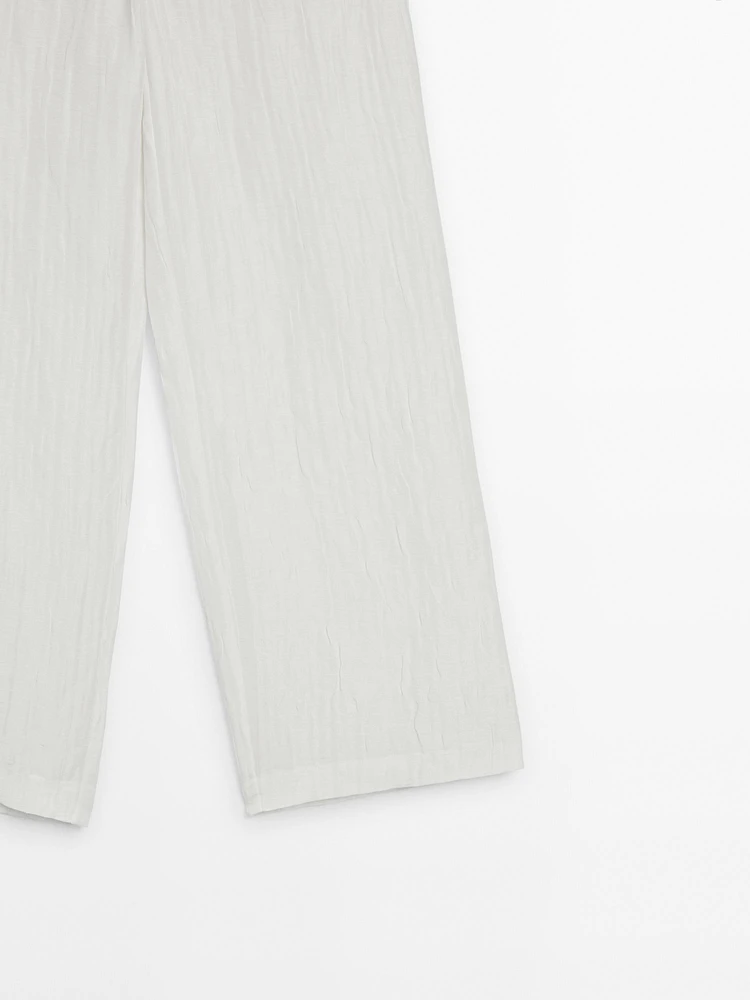 Flowing creased-effect trousers