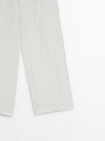 Flowing creased-effect trousers