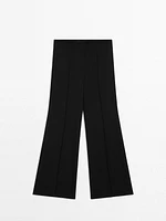 Flared trousers with zip