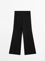 Flared trousers with zip