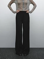 Flared trousers with zip