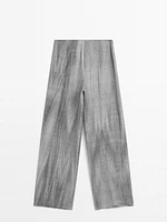 Trousers with 100% linen fabric detail