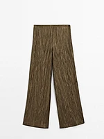 Trousers with metallic fabric detail