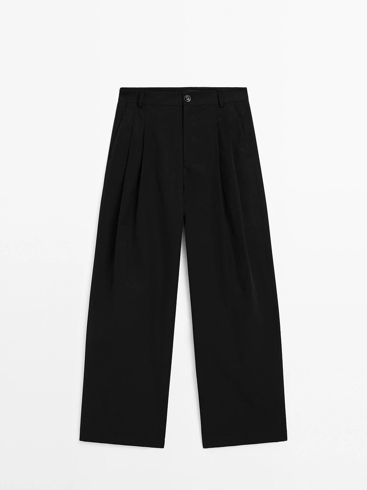 Wide-leg pleated cotton blend trousers