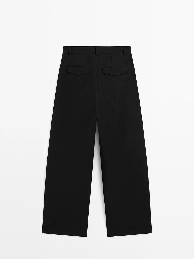 Wide-leg pleated cotton blend trousers