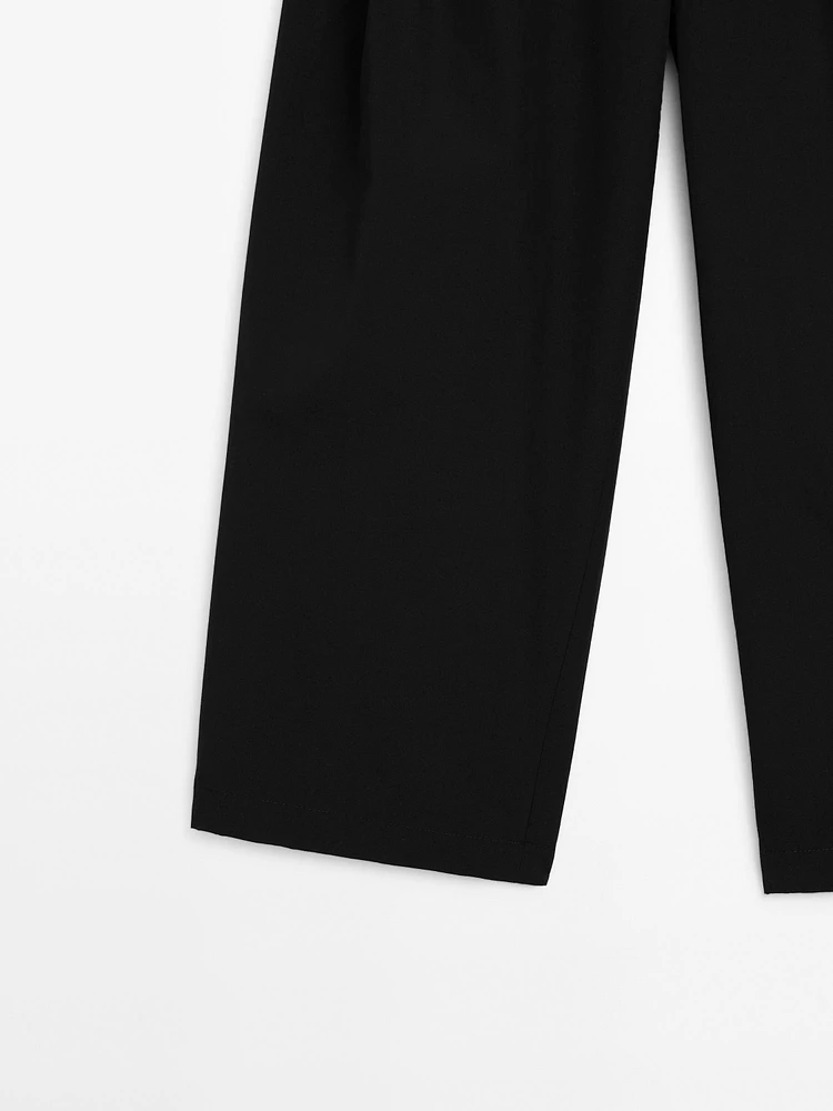 Wide-leg pleated cotton blend trousers