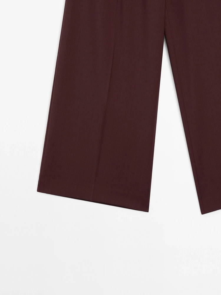 Pantalon à pinces satiné 100 % laine