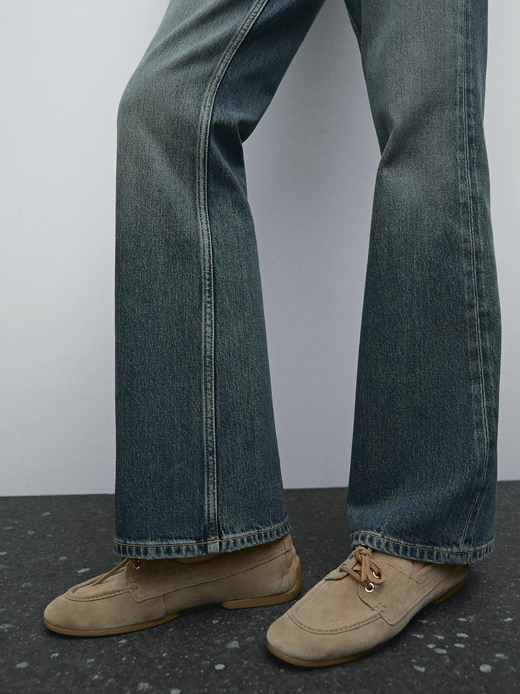 High-waist boot-cut cotton blend jeans